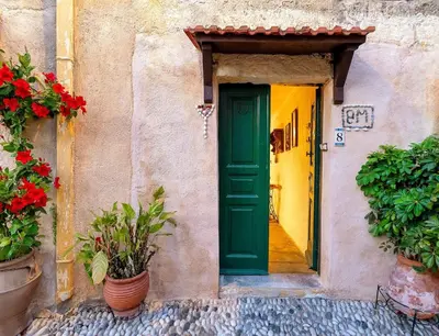 an entrance to a building with a green door at Levent Traditional Villa Rhodes Castle in Rhodes Town
