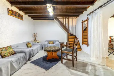 a living room with a couch and a table at Levent Traditional Villa Rhodes Castle in Rhodes Town