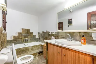 a bathroom with a toilet and a sink and a mirror at Levent Traditional Villa Rhodes Castle in Rhodes Town