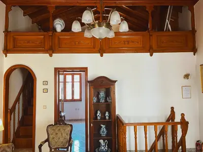 a room with a ceiling with a chandelier at Margo Traditional House in Symi