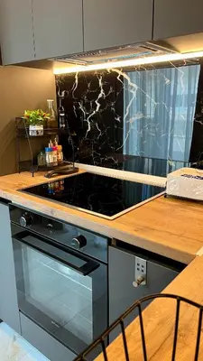 a kitchen with a stove and a counter top at Apartamento Elegante de Chris in Rhodes Town