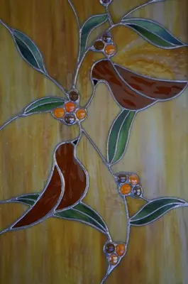 a stained glass window with birds on a branch at Hotel Ellique in Rhodes Town