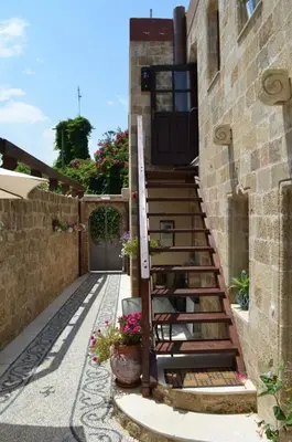a set of stairs leading up to a building at Hotel Ellique in Rhodes Town