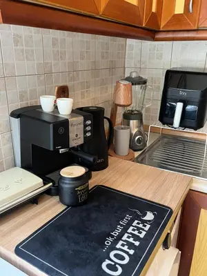 a coffee maker on a counter in a kitchen at Ciel Apartment in Rhodes Town