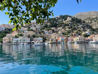 a view of a town on a hill over water at Angela House in Symi