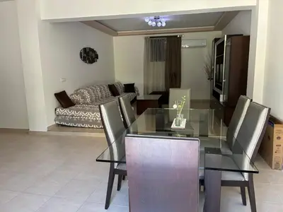 a dining room with a glass table and chairs at Angela House in Symi