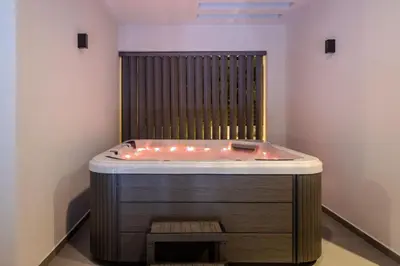 a jacuzzi tub with lights in a room at Villa Viventia with Heated Pool in Afantou