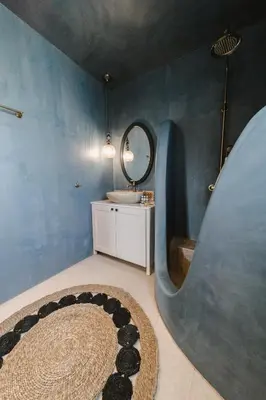 a bathroom with a circular sink and a mirror at Pura Vida Beach House in Kiotari