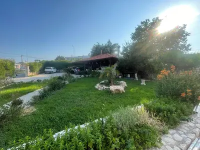 a garden in front of a house at Casa Stefania in Faliraki