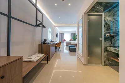 a bathroom with a large aquarium in the wall at Philia Center Suites in Rhodes Town