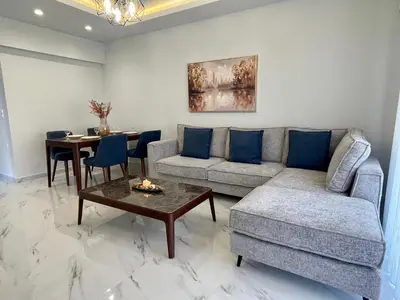 a living room with a couch and a table at Anastasia House in Afantou