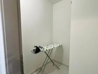 a tripod in a room with a white wall at Anastasia House in Afantou