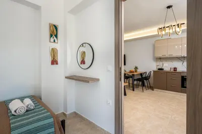 a room with a bed and a dining room at Mayas Boutique Greece Rhodes Kremasti in Kremasti