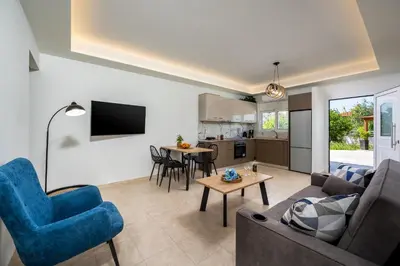 a living room with a couch and a table at Mayas Boutique Greece Rhodes Kremasti in Kremasti