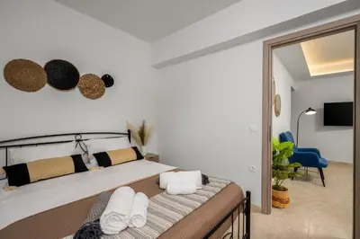 a bedroom with a bed with towels on it at Mayas Boutique Greece Rhodes Kremasti in Kremasti