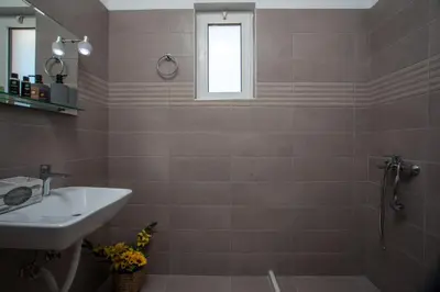 a bathroom with a sink and a shower at Bless View Studios in Lachania