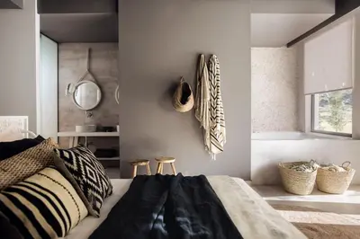 a bedroom with a bed and a mirror on the wall at Casa Cook Rhodes (Adults Only) in Kolimbia