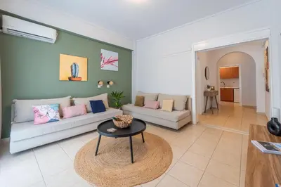a living room with a couch and a table at Residence City Frida in Rhodes Town