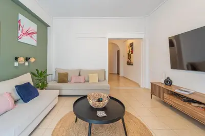 a living room with a couch and a table at Residence City Frida in Rhodes Town