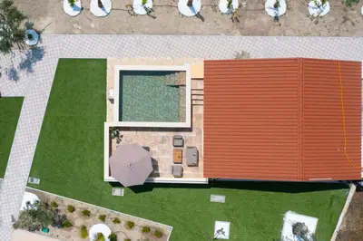 an overhead view of a building with an umbrella at Anthi Luxury Residence in Triánta