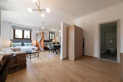 a living room with a couch and a table at Anthi Luxury Residence in Triánta