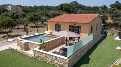 an aerial view of a house with a swimming pool at Anthi Luxury Residence in Triánta