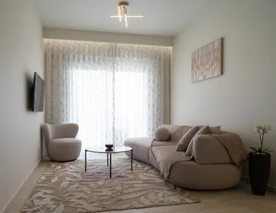 a living room with a couch and a table at Casa di Anna Seaside in Rhodes Town