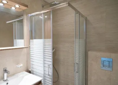 a bathroom with a glass shower and a sink at Casa di Anna Seaside in Rhodes Town