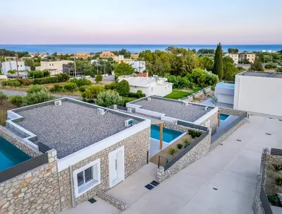 an aerial view of a house with a swimming pool at Gennadi GEMS Villas in Gennadi