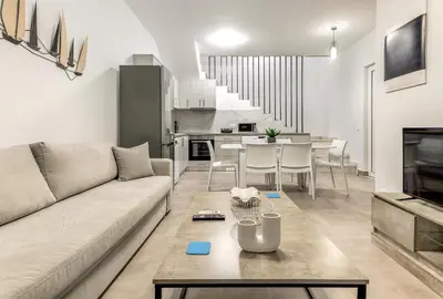 a living room with a couch and a table at Gennadi GEMS Villas in Gennadi