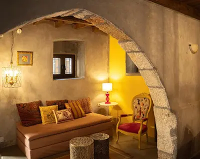 a living room with a couch and a chair at Ottoman's Manor in Rhodes Town
