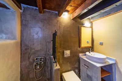 a bathroom with a sink and a mirror at Ottoman's Manor in Rhodes Town