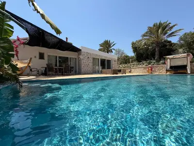 a large swimming pool in front of a house at Villa Splendide in Rhodes Town