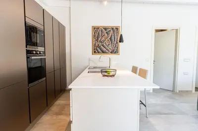 a kitchen with a white counter and a sink at Villa Splendide in Rhodes Town