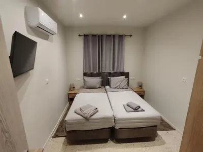 a bedroom with a bed and a window in it at PaMar in Faliraki