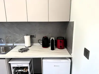 a kitchen with a counter with appliances on it at Date Palm Studio in Kremasti