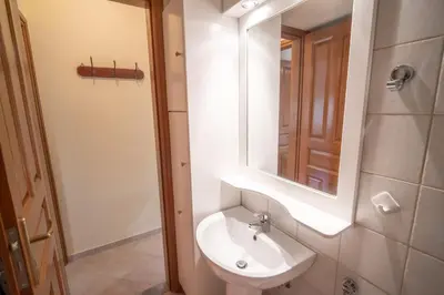 a bathroom with a sink and a mirror at Mythos House - Seaside Retreat in Pedi in Symi