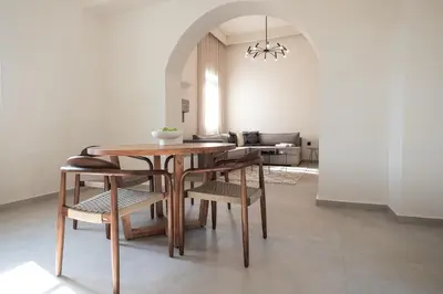 a dining room with a table and chairs at Casa Alini in Ialyssos