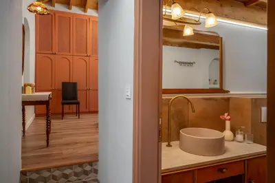 a bathroom with a sink and a mirror at Siliguri Traditional House in Rhodes Town