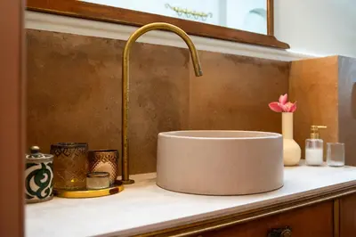 a sink with a faucet on top of a counter at Siliguri Traditional House in Rhodes Town