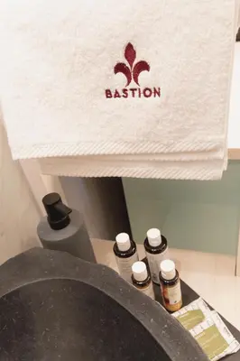 a box with the name of a bathroom with five bottles at Bastion Luxury Medieval Accommodation in Rhodes Town