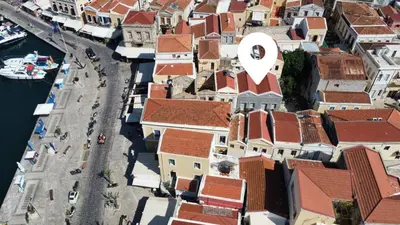 an aerial view of a city with buildings at Charistella Apartment in Symi