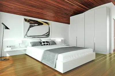 a bedroom with a white bed and a wooden ceiling at Semi-detached house with private pool in Lardos