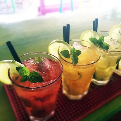 a group of four drinks sitting on a tray at Mojito Beach Rooms in Lachania