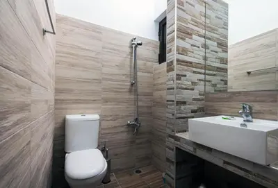 a bathroom with a toilet and a sink at Mojito Beach Rooms in Lachania