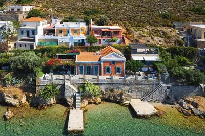 an aerial view of a house on the water at Gama luxury living in Symi