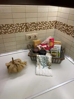 a basket of food on a sink in a bathroom at Casa Maria Tsampika-Spacious Home with 2 Bathrooms & Free Parking in Psinthos