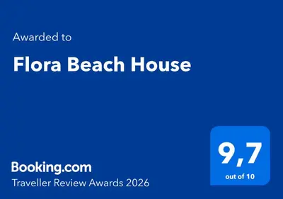 a screenshot of a phone with the flora beach house at Flora Beach House in Kremasti