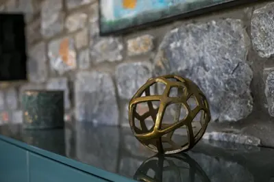 a metal object sitting on top of a glass table at Villa Clara in Gennadi