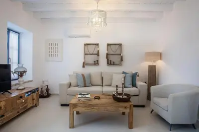 a living room with a couch and a coffee table at Anteli Luxury Villa in Halki